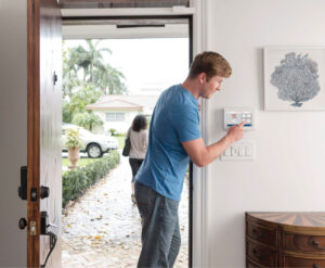 Man Leaving Home initiating alarm sequence on Command Panel